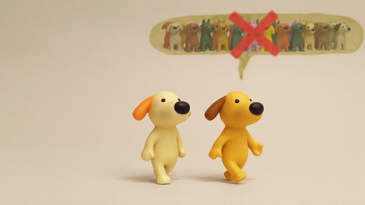 Two dogs, one wide comfortable gap: the distance is the treatment — the crowded dog park is not
